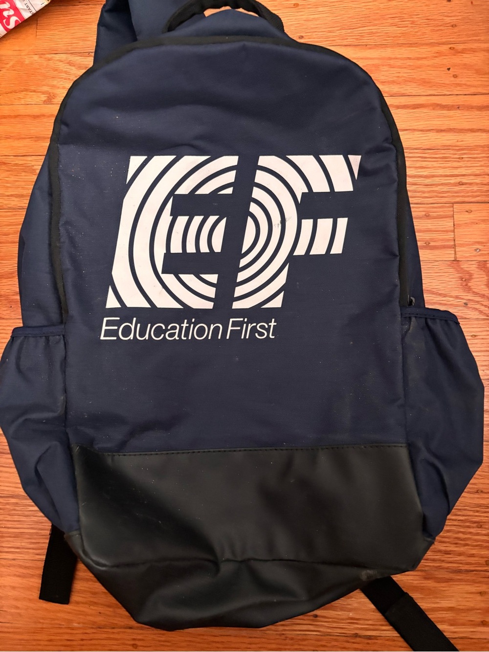 “Education First” logo backpack in navy blue